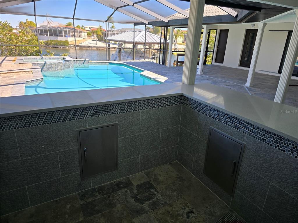 937 Bunker View Drive Apollo Beach, FL 33572 - Photo 48 of 73 a bathroom with washing machine and racks