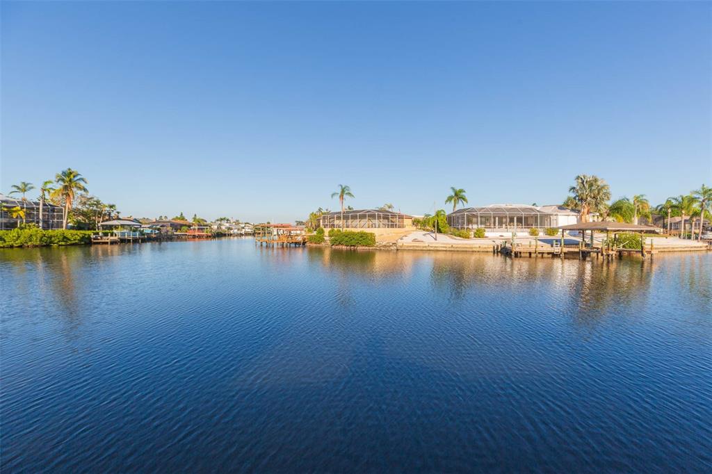 937 Bunker View Drive Apollo Beach, FL 33572 - Photo 58 of 73 a view of an ocean with boats and trees in the background