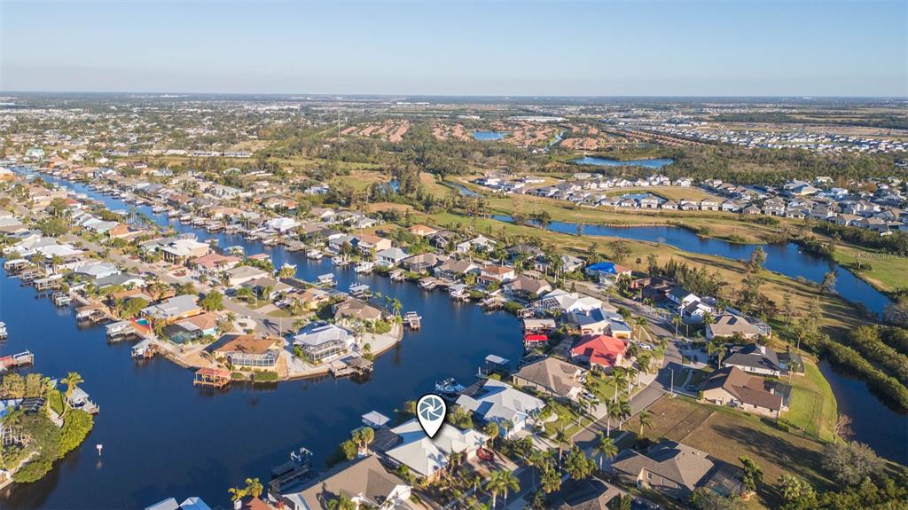 937 Bunker View Drive Apollo Beach, FL 33572 - Photo 68 of 73 an aerial view of lake and residential houses with outdoor space