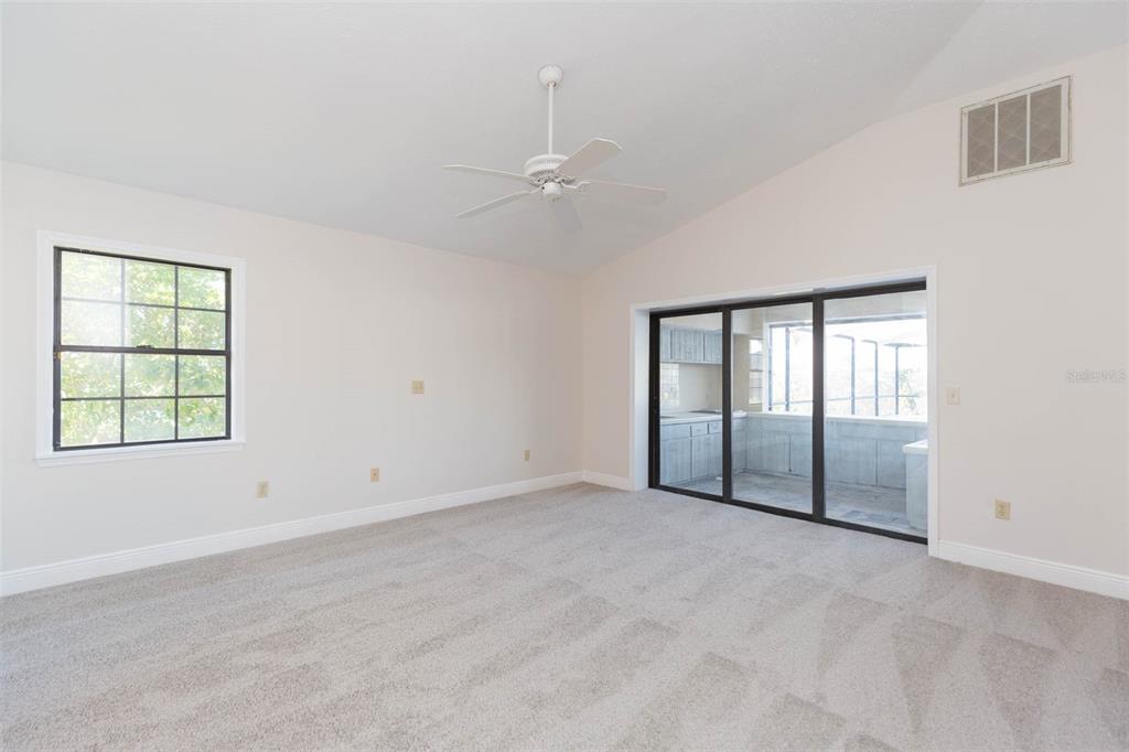 937 Bunker View Drive Apollo Beach, FL 33572 - Photo 10 of 73 an empty room with windows and ceiling fan