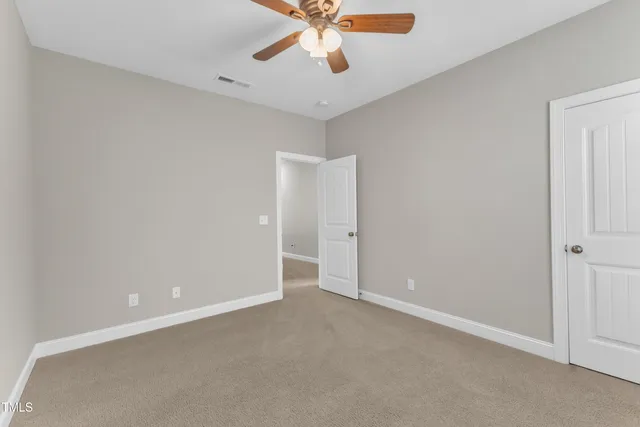 a bathroom with a bathtub and a window