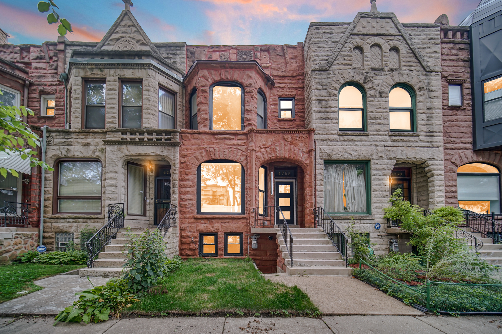 a front view of a house with a garden
