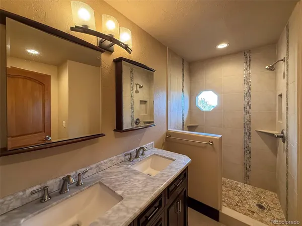 a white toilet sitting next to a shower