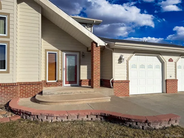 a front view of a house with a garage