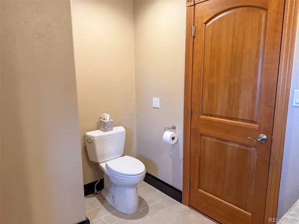 a view of a room with furniture and wooden floor