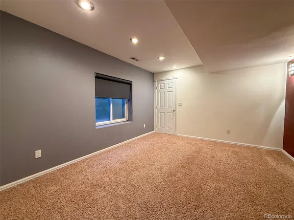 a view of a balcony with wooden floor