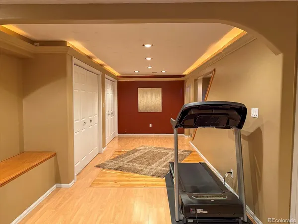 a front view of a house with a garden and yard