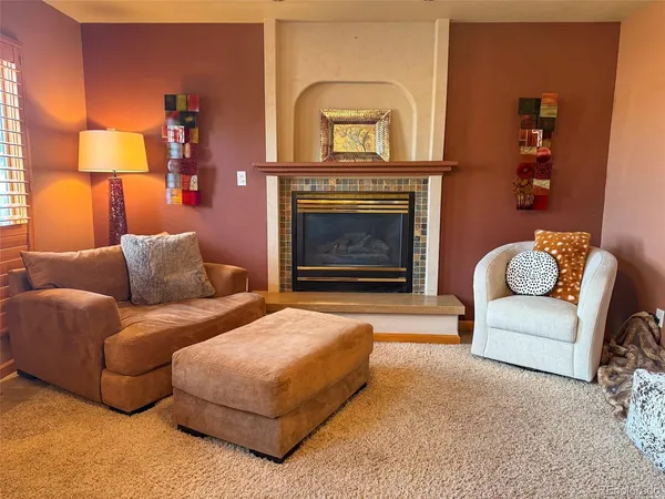 a room with a window and a chair