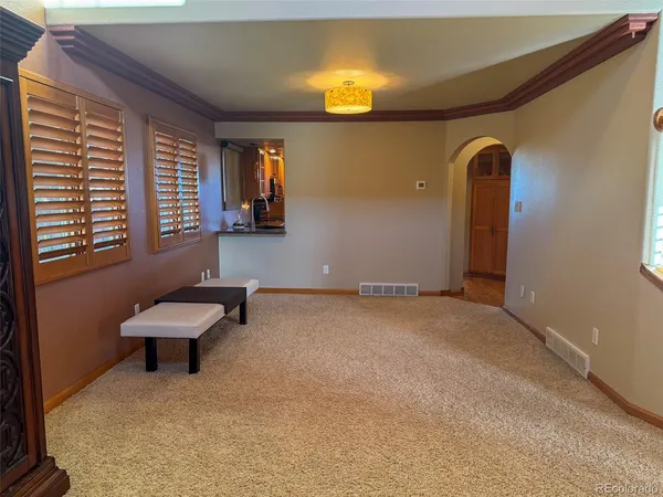 a bathroom with a toilet and a mirror
