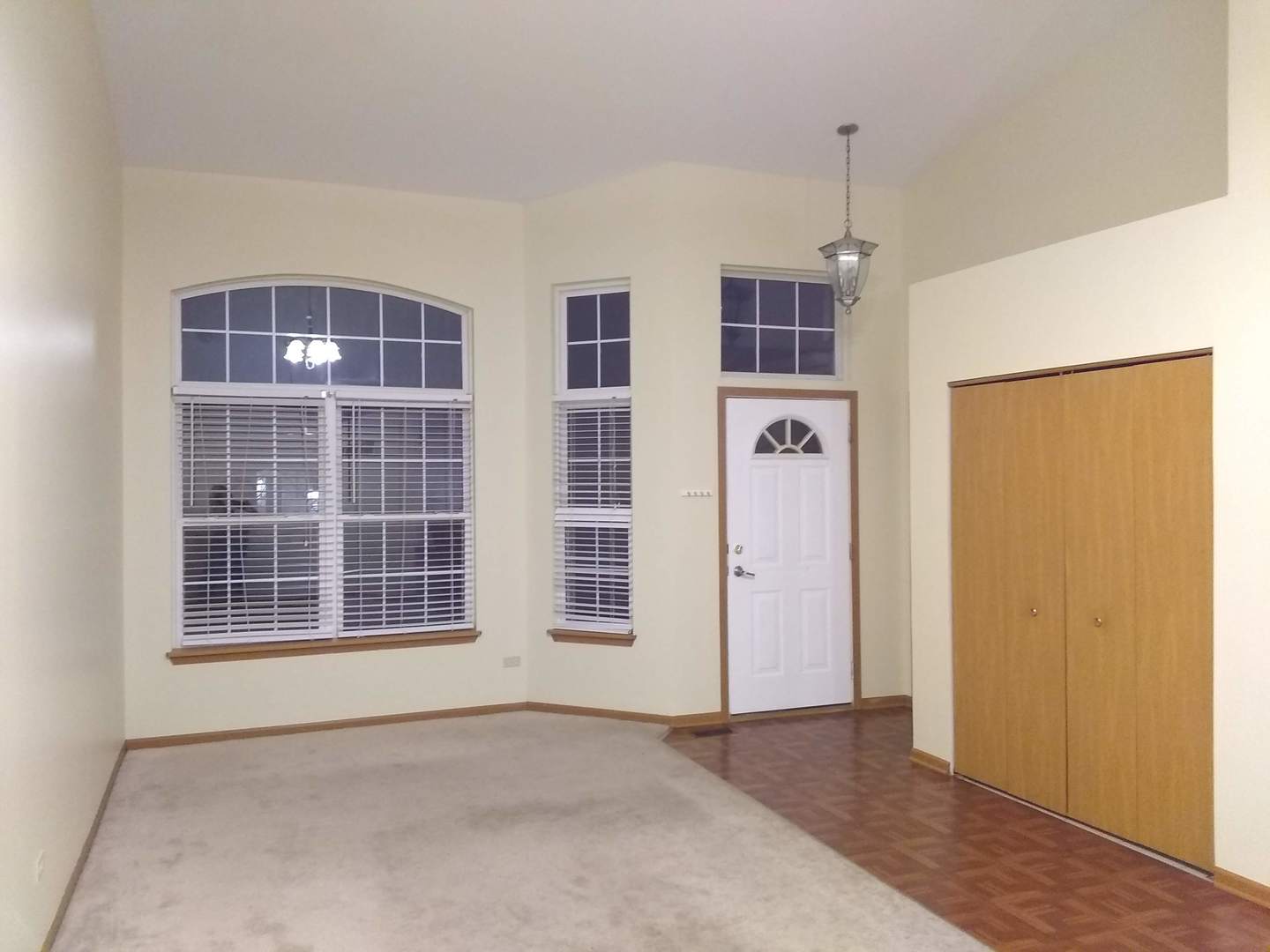 2103 Beldon Court Plainfield, IL 60586 - Photo 2 of 16 an empty room with windows