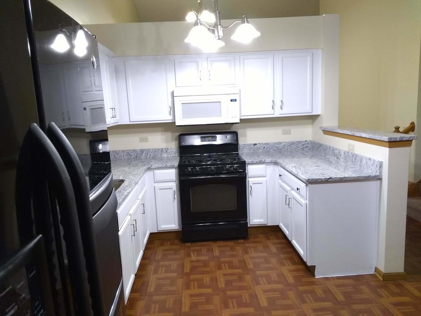 2103 Beldon Court Plainfield, IL 60586 - Photo 4 of 16 a kitchen with granite countertop a refrigerator stove and sink