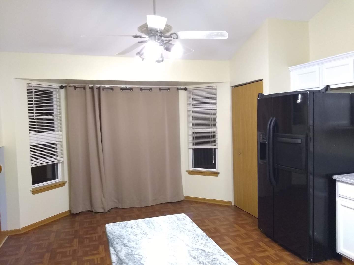 2103 Beldon Court Plainfield, IL 60586 - Photo 5 of 16 a view of a hallway with wooden floor and a cabinet