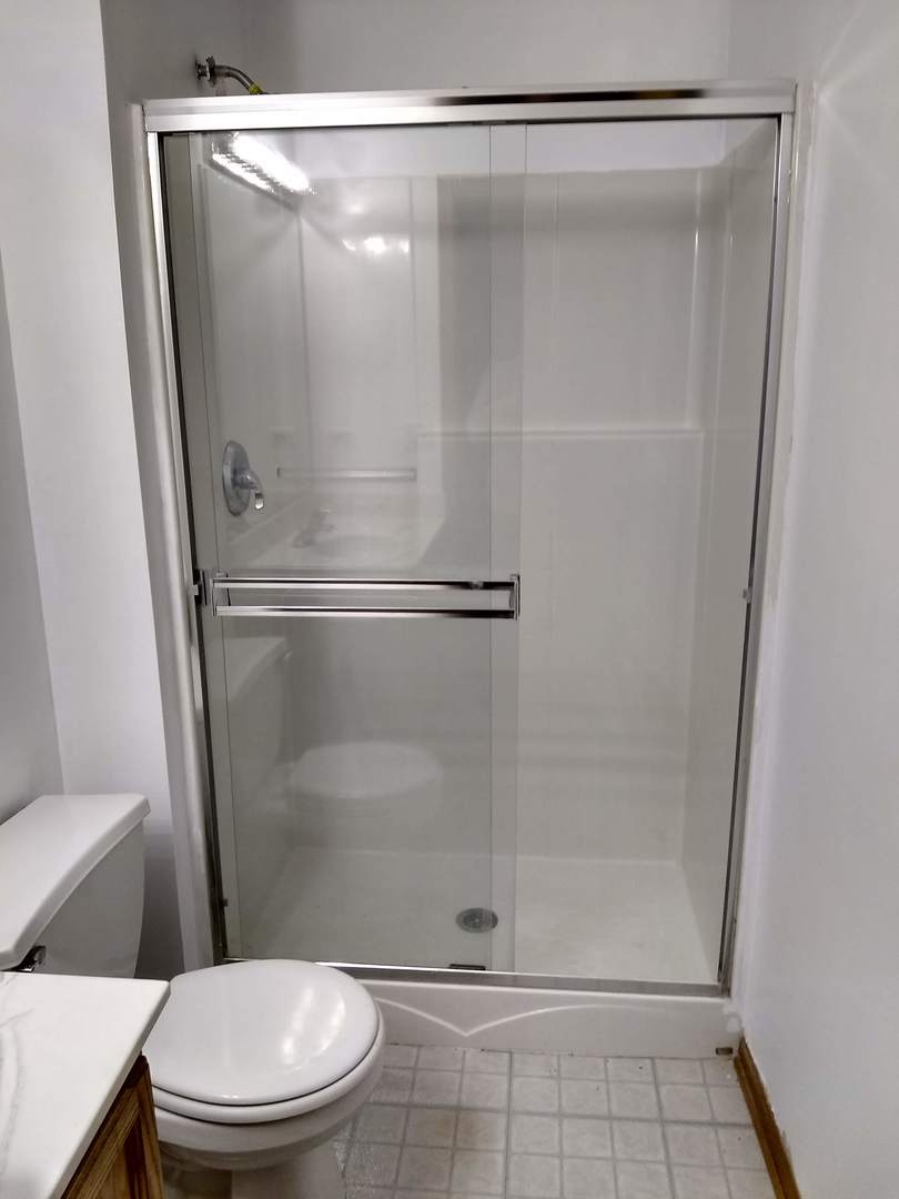 2103 Beldon Court Plainfield, IL 60586 - Photo 9 of 16 a bathroom with a glass shower door
