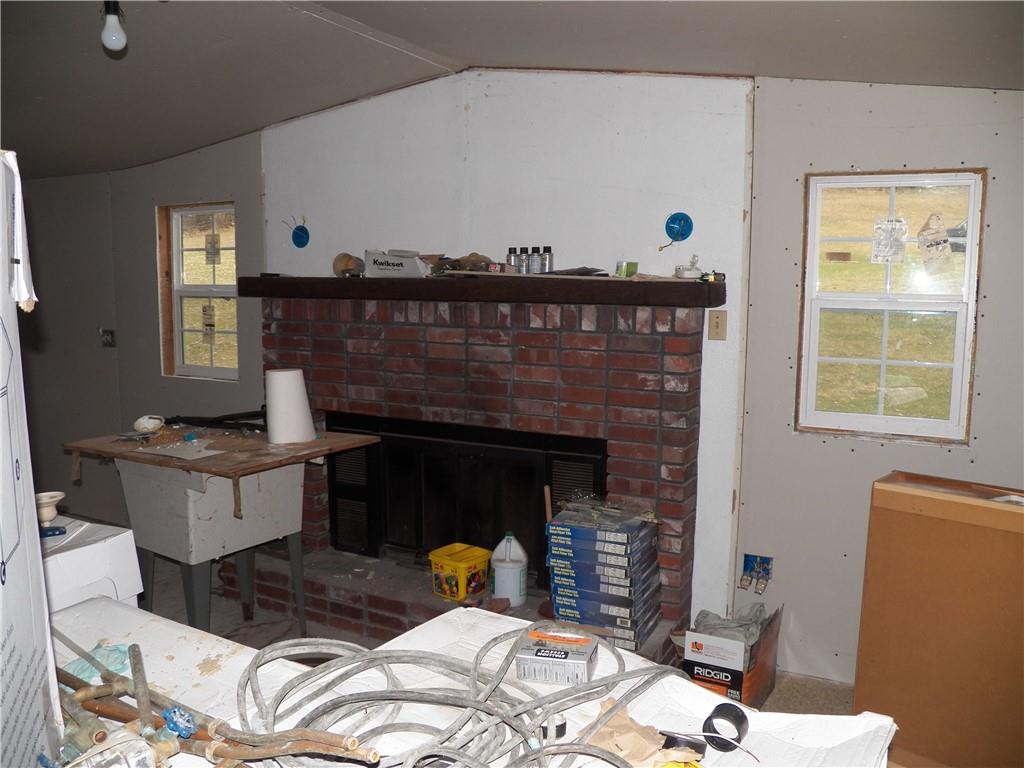 709 Cherry Lane Road Apollo, PA 15613 - Photo 5 of 14 a living room with furniture and a fireplace