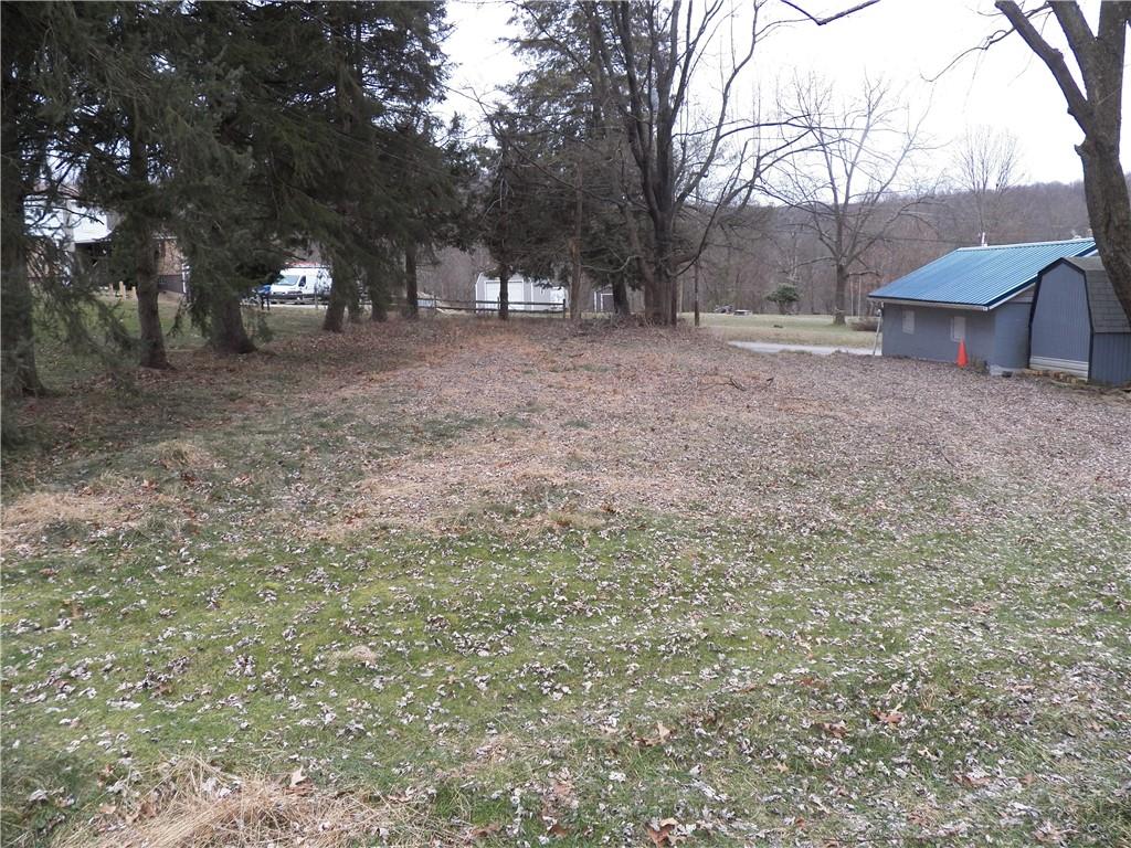 709 Cherry Lane Road Apollo, PA 15613 - Photo 10 of 14 a view of a yard with a house and a tree