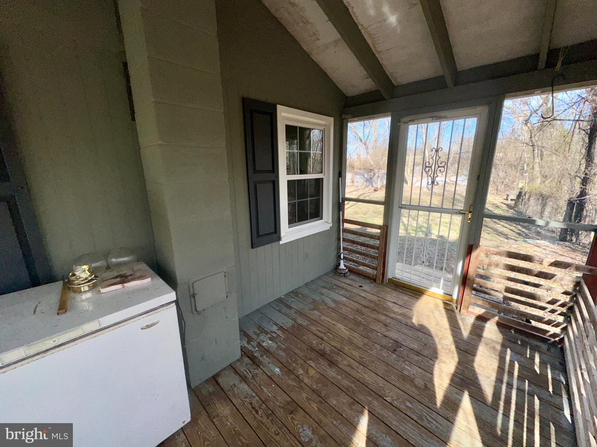 1336 Old Winchester Road Boyce, VA 22620 - Photo 56 of 76 a storage room with wooden floor and furniture