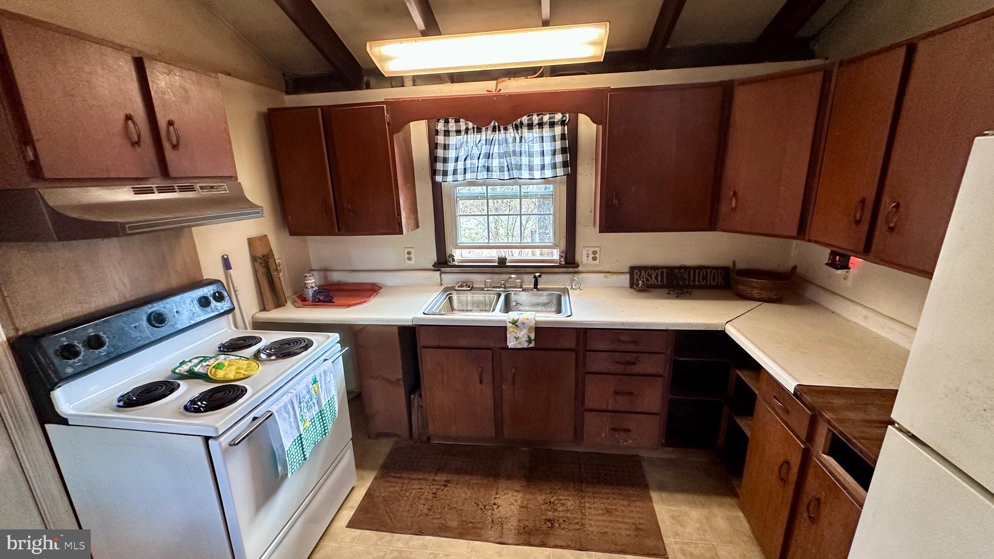 1336 Old Winchester Road Boyce, VA 22620 - Photo 7 of 76 a kitchen with a sink a stove and a refrigerator