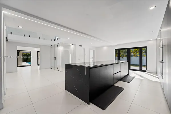 a view of a chairs in a hall with a sink
