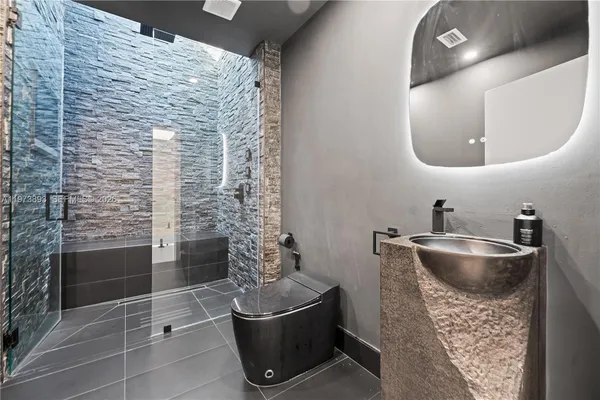 a spacious bathroom with a tub and a shower