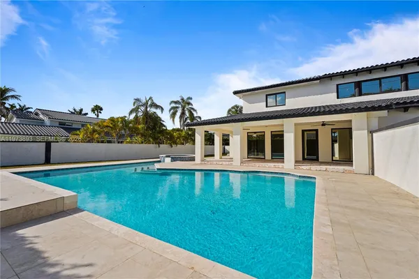 a view of swimming pool with a yard