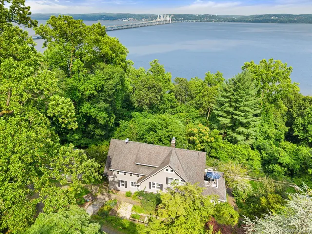an aerial view of a house with a lake view