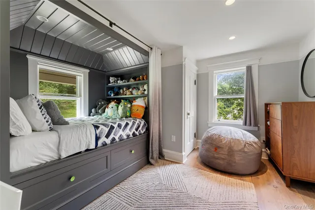 a bedroom with a large bed and a window