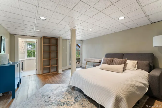 a spacious bedroom with a large bed and a window