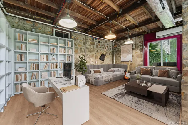 a living room with furniture and a large window