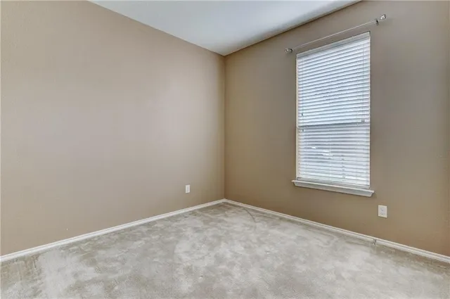 an empty room with closet area