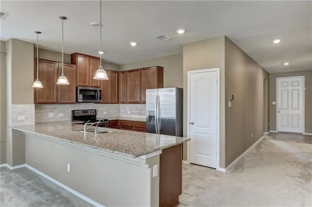 a view of a kitchen with marble kitchen and kitchen area