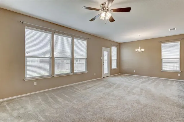 a kitchen with kitchen island a sink stainless steel appliances and cabinets