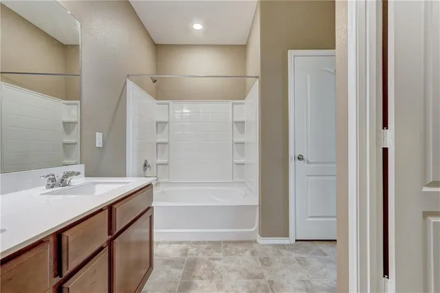 a view of storage and utility room with closet