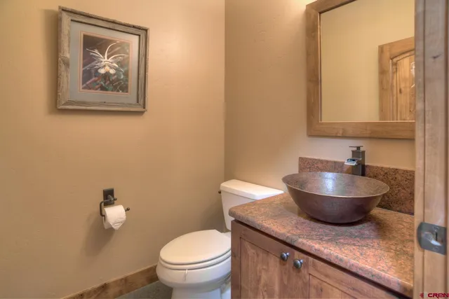 a bedroom with a bed and a night stand