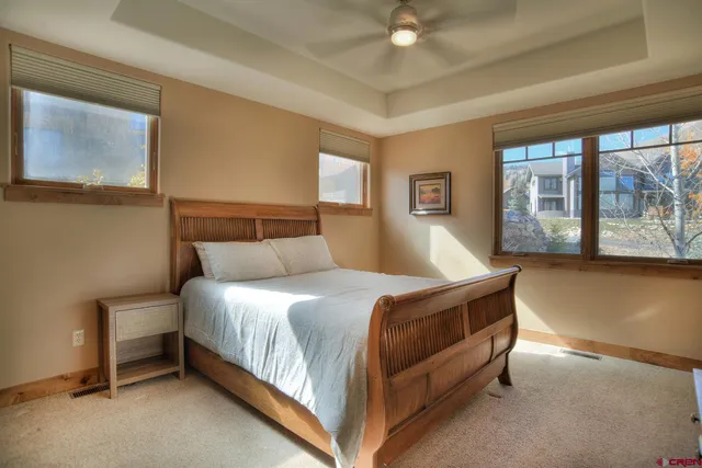 a bedroom with a large bed and a couch