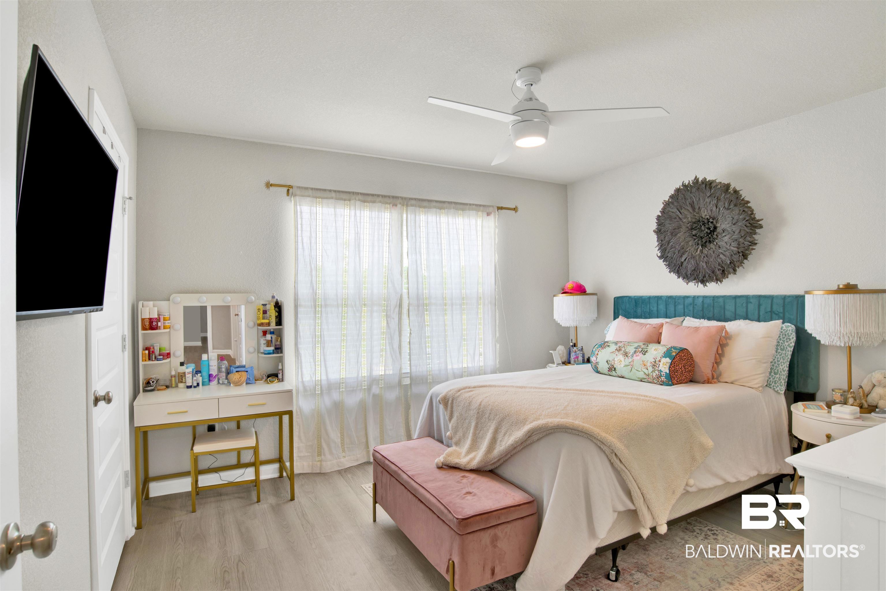 24532 Broken Sound Loop Orange Beach, AL 36561 - Photo 23 of 29 Bedroom with light hardwood / wood-style flooring and ceiling fan