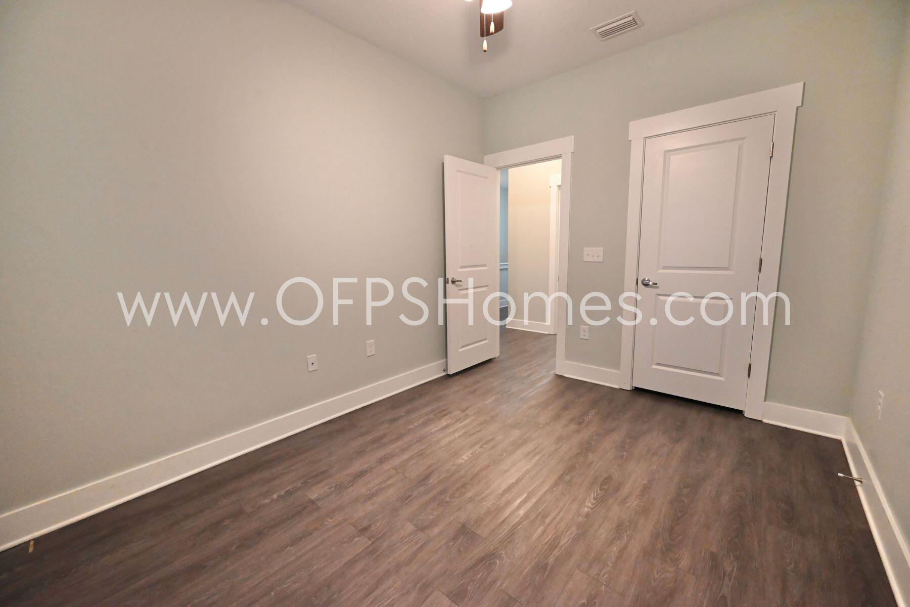 312 North Sand Palm Road Freeport, FL 32439 - Photo 11 of 26 a view of an empty room with wooden floor