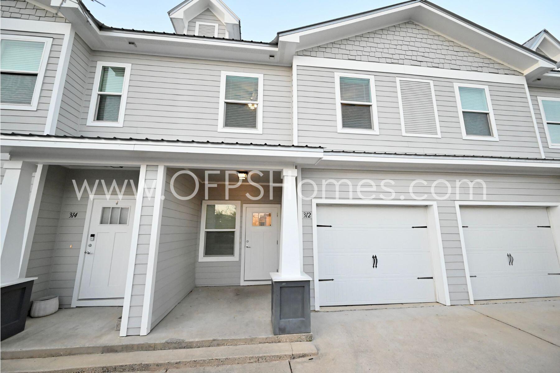 312 North Sand Palm Road Freeport, FL 32439 - Photo 2 of 26 a front view of a building