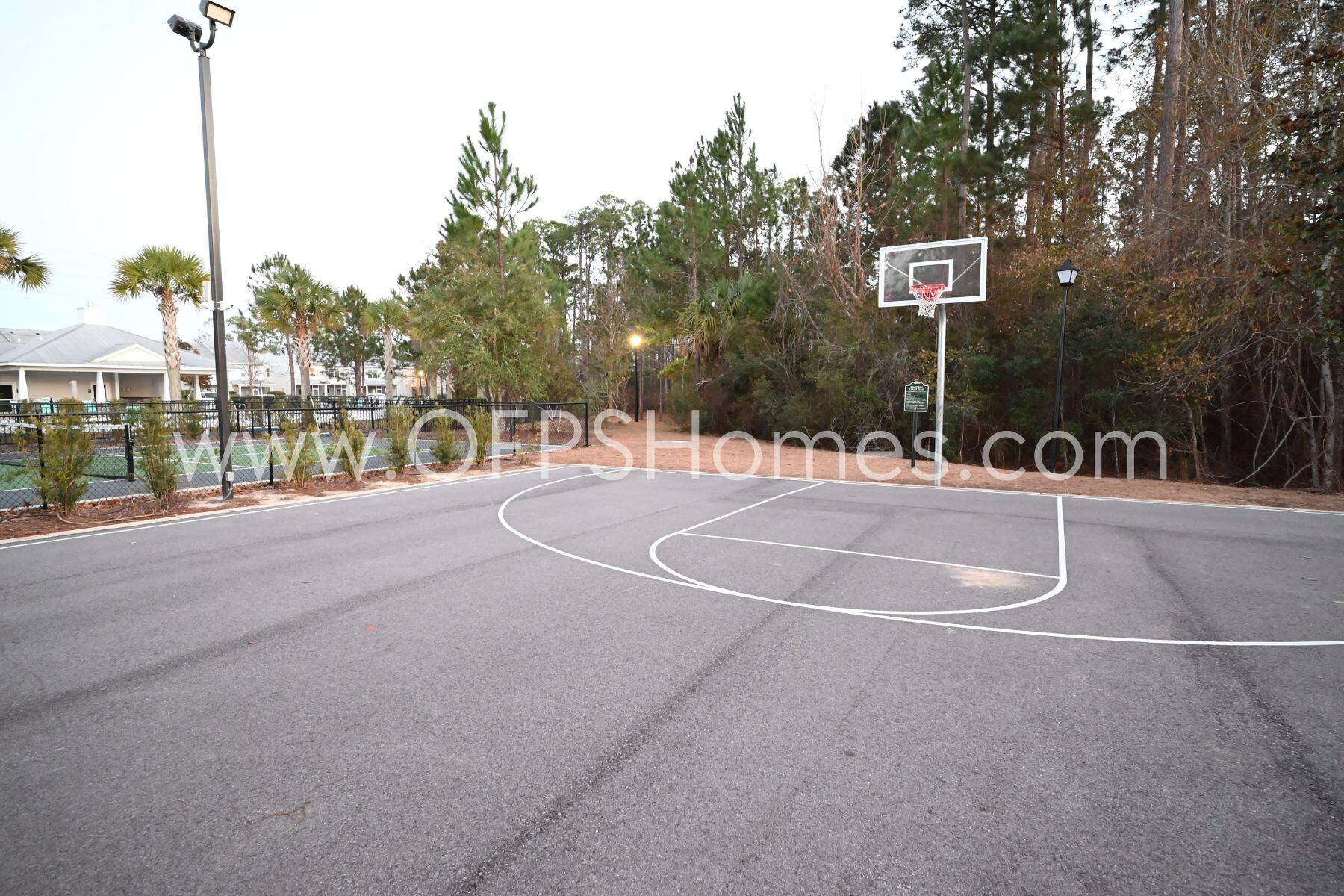 312 North Sand Palm Road Freeport, FL 32439 - Photo 26 of 26 a swimming pool with outdoor seating and yard in the back