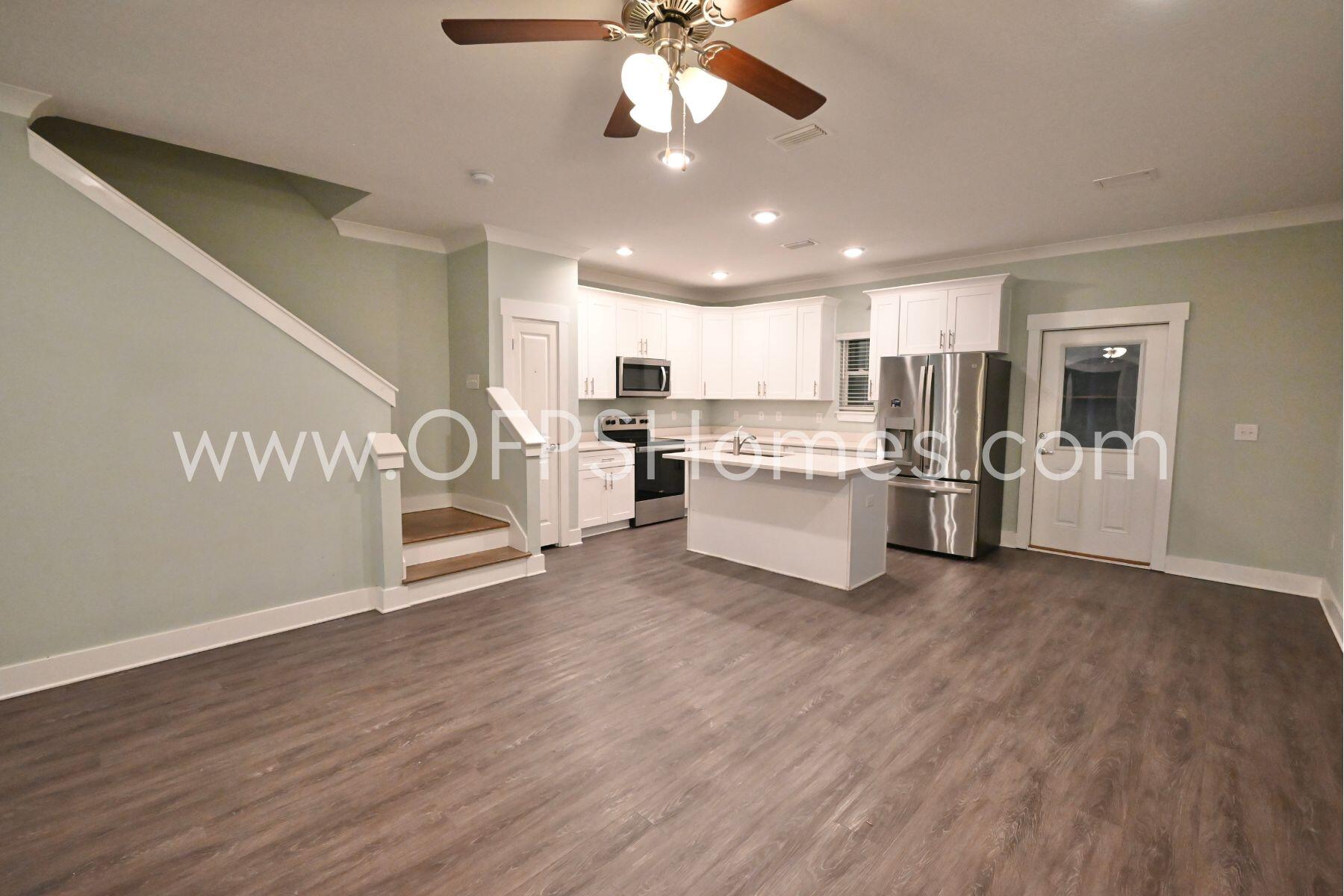 312 North Sand Palm Road Freeport, FL 32439 - Photo 9 of 26 a view of a kitchen with wooden floor electronic appliances and furniture