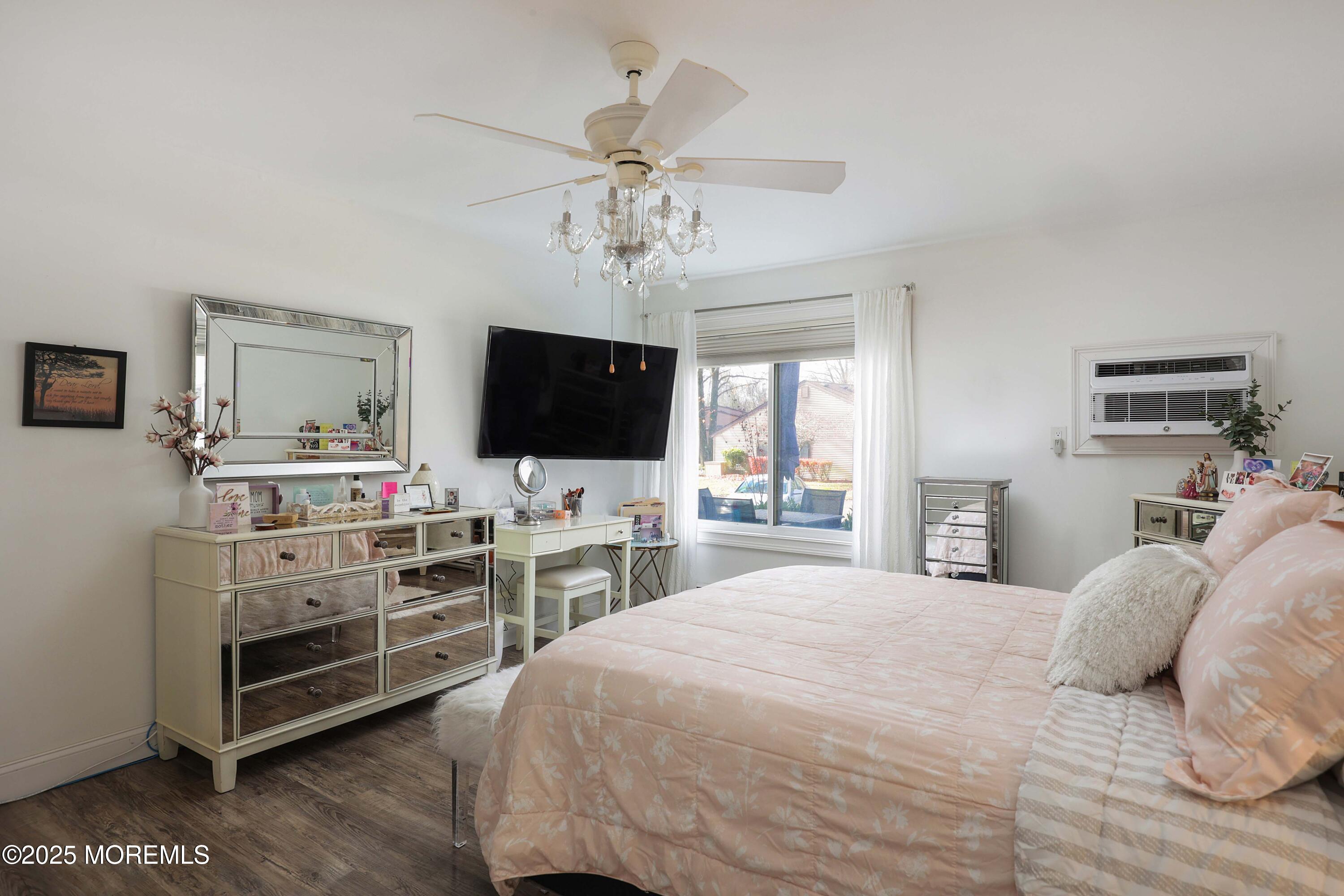 126 Manchester Court Red Bank, NJ 07701 - Photo 13 of 22 a bedroom with a bed and a flat screen tv