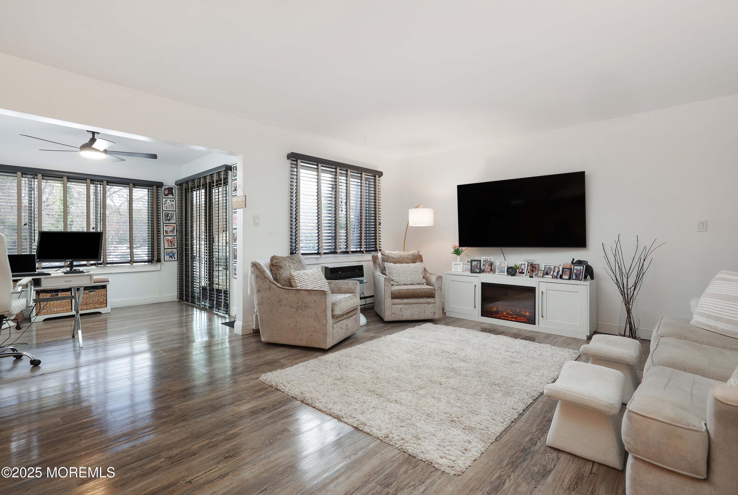 126 Manchester Court Red Bank, NJ 07701 - Photo 3 of 22 a living room with furniture and a flat screen tv