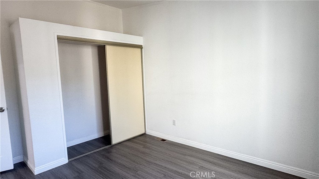 56515 Dickson Way Anza, CA 92539 - Photo 13 of 17 a view of an empty room with wooden floor