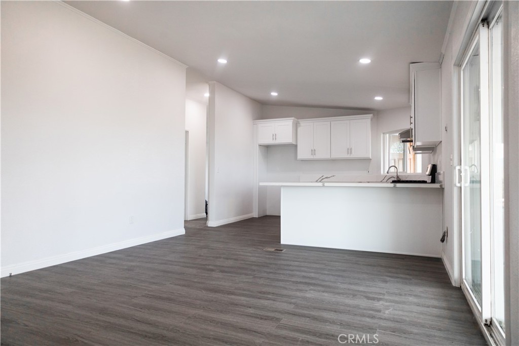 56515 Dickson Way Anza, CA 92539 - Photo 7 of 17 a view of kitchen with kitchen island wooden cabinets and center island