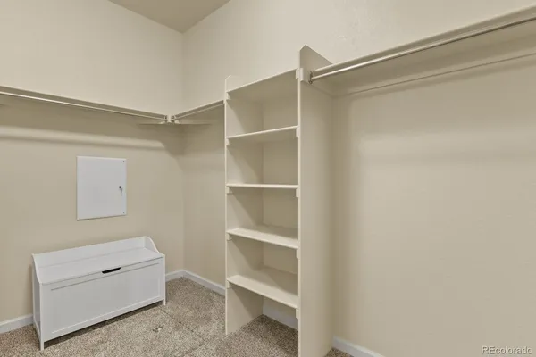 a room with a closet and a cabinet