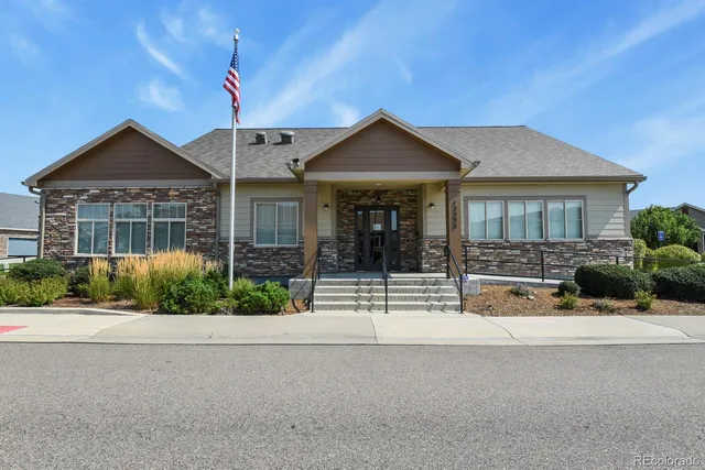 a view of house with swimming pool and yard