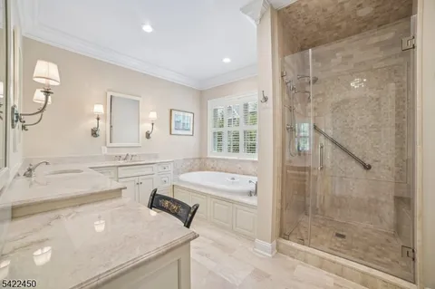 a spacious bathroom with a sink mirror and a bath tub