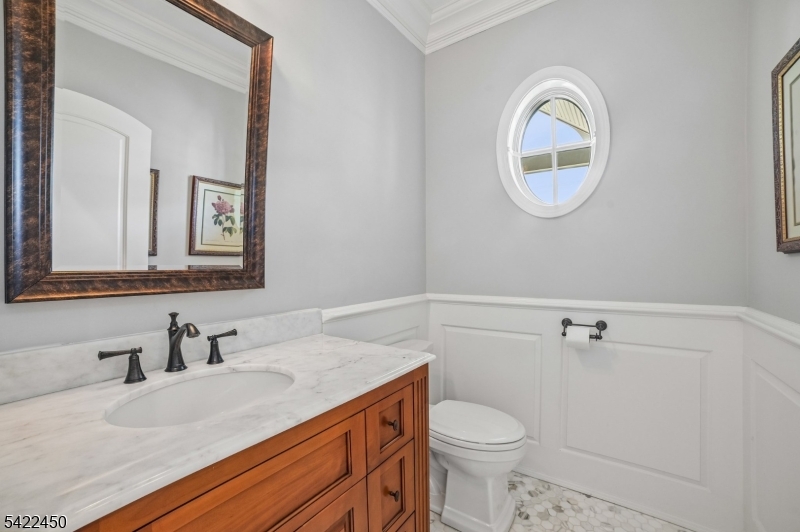 74 Noe Avenue Madison, NJ 07940 - Photo 15 of 27 a bathroom with a granite countertop sink mirror and toilet