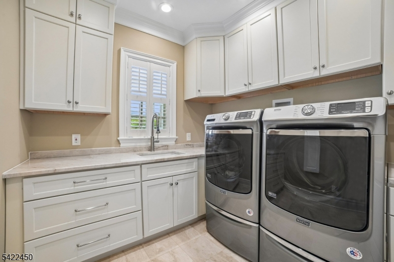 74 Noe Avenue Madison, NJ 07940 - Photo 16 of 27 a kitchen with granite countertop white cabinets and stainless steel appliances
