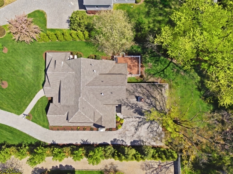 74 Noe Avenue Madison, NJ 07940 - Photo 24 of 27 an aerial view of a house with a yard and garden