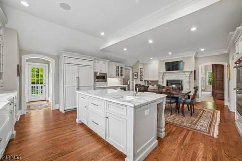 a large kitchen with stainless steel appliances lots of counter top space